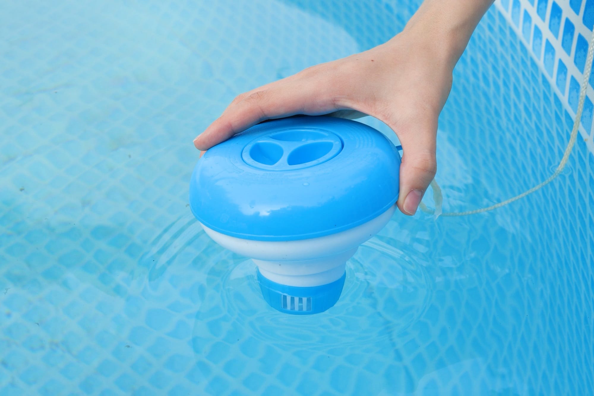 Worker hands isinfection and chlorination of water in the pool.